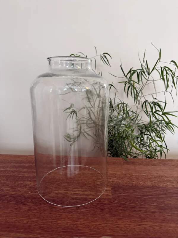 Glasklokke med åbning foroven